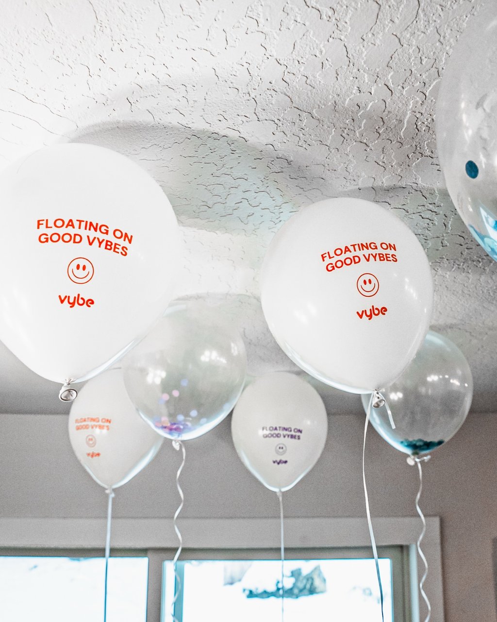 Confetti & 'Floating On Good Vybes' Balloons